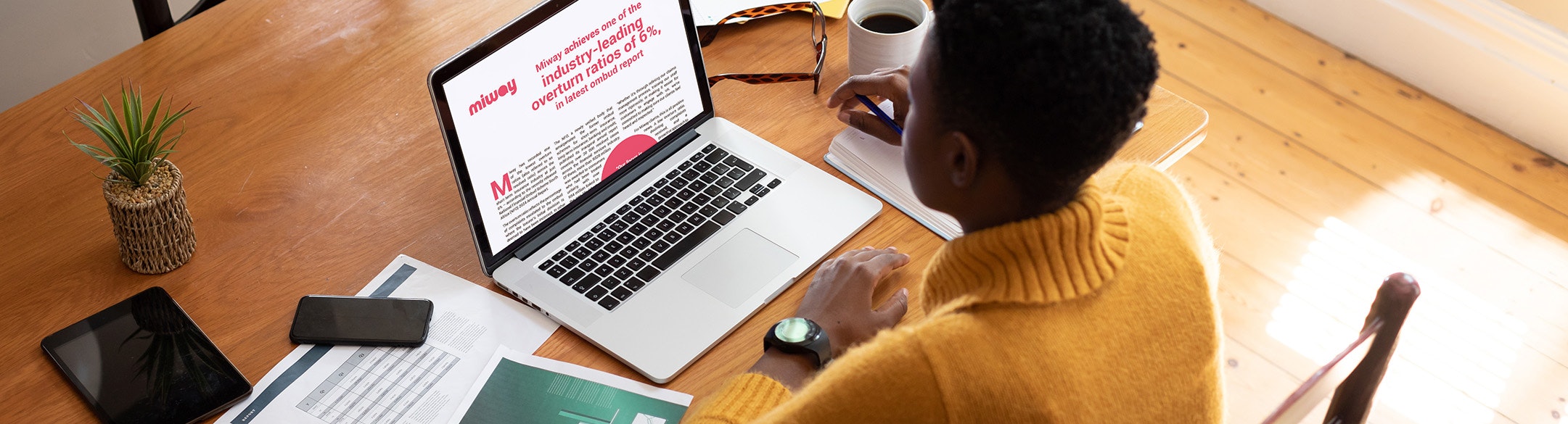 Person reading article on laptop