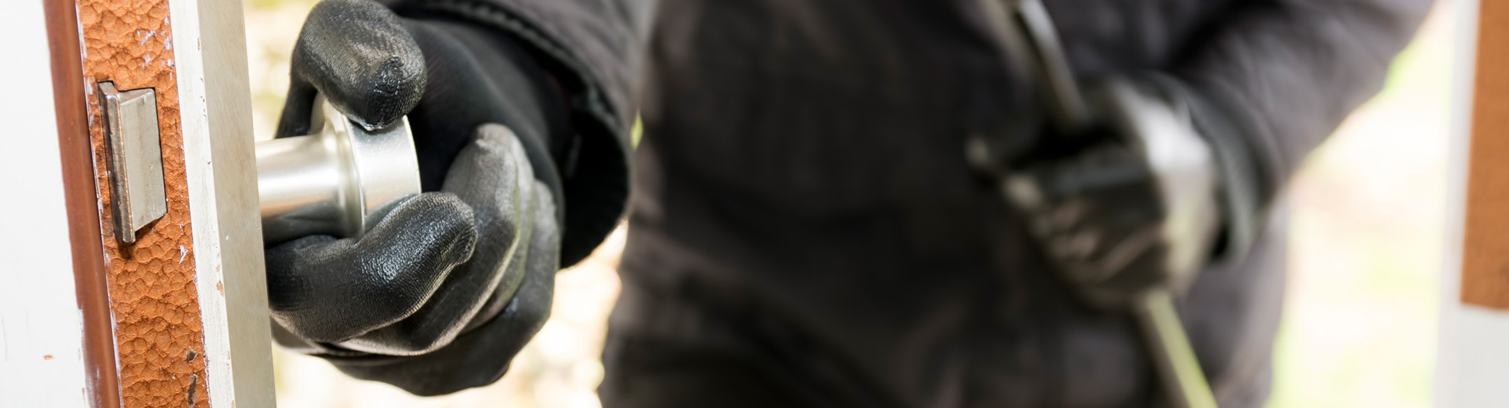 Criminal opening door of house