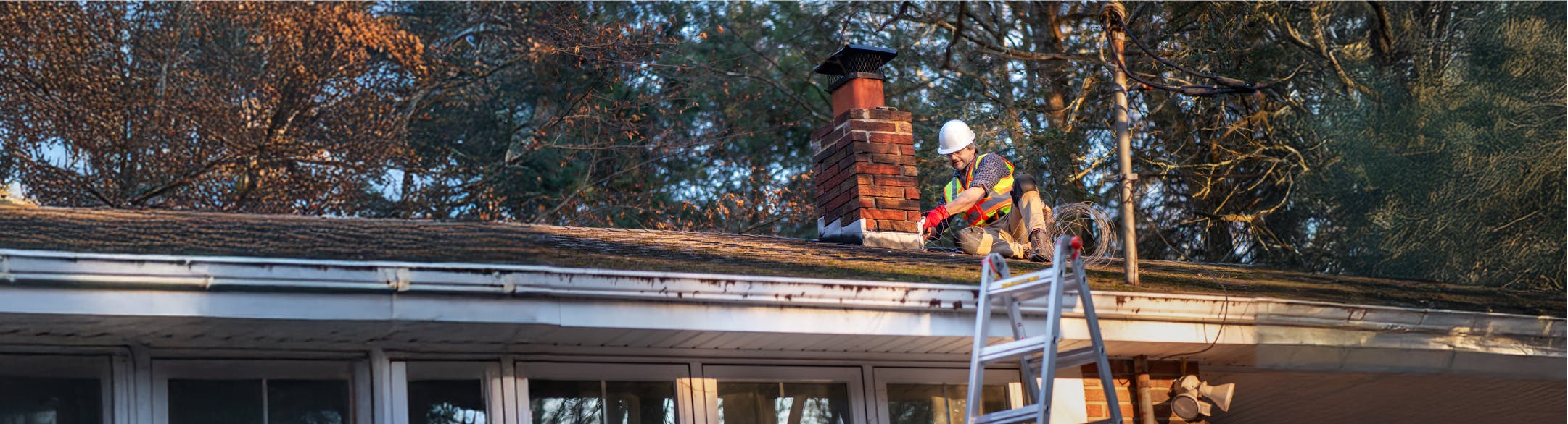 man fixing roof
