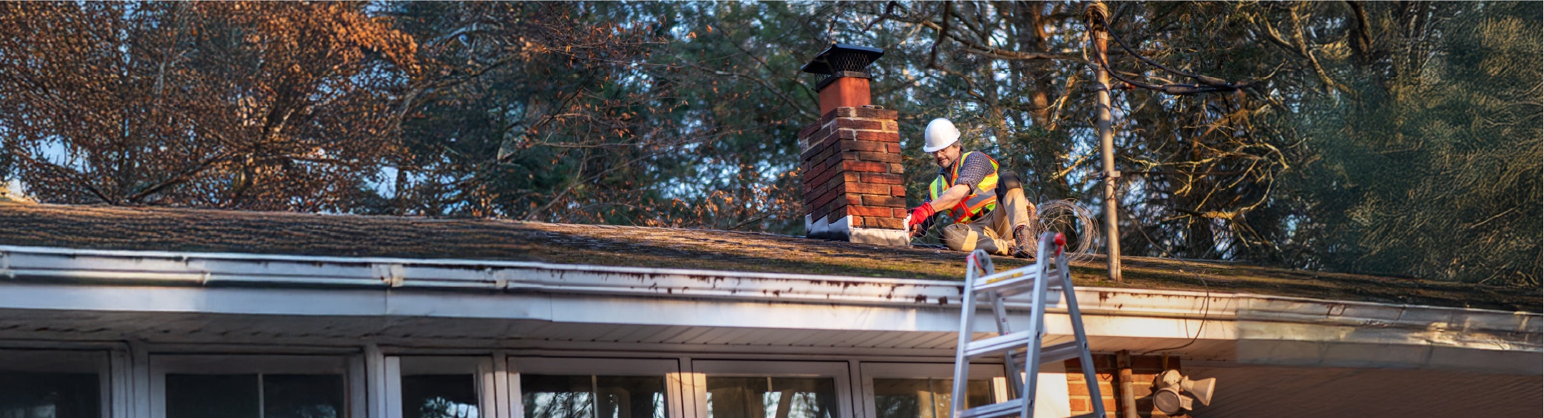 man fixing roof