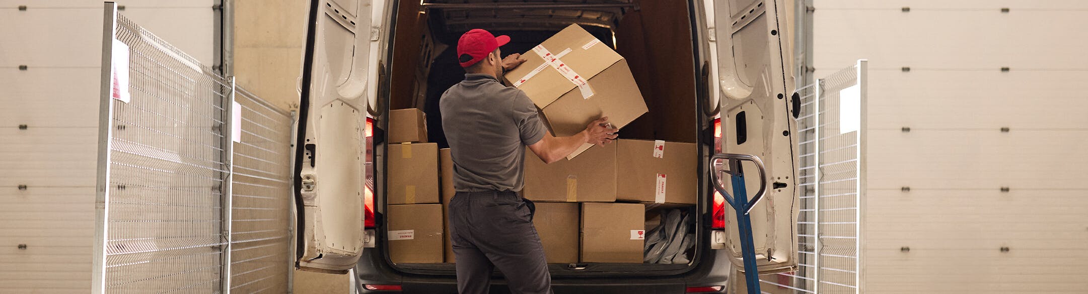 Man loading boxes into a truck