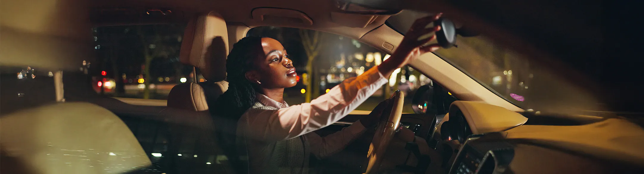 woman in car at night