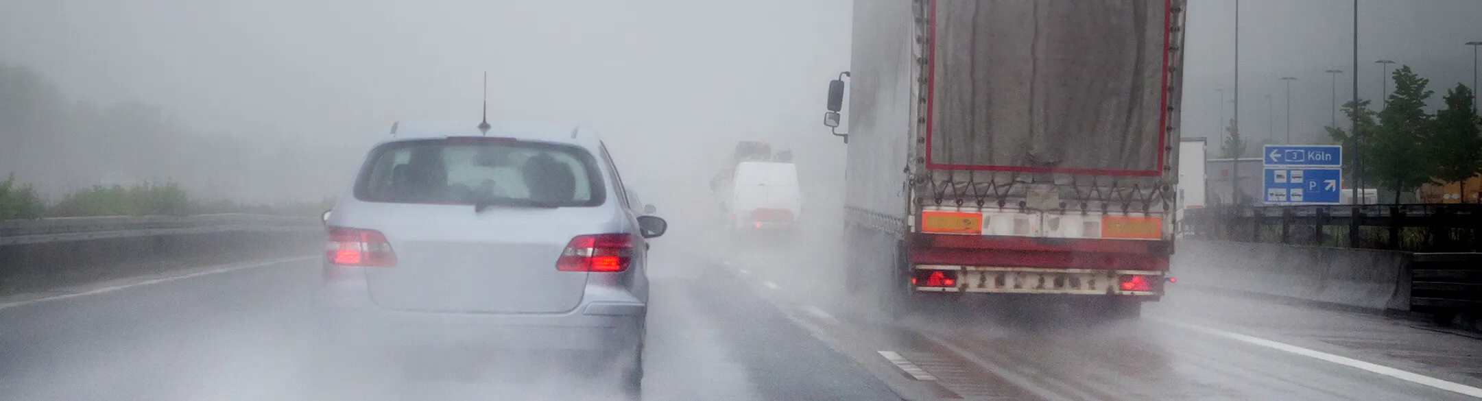 vehicles driving in heavy rain