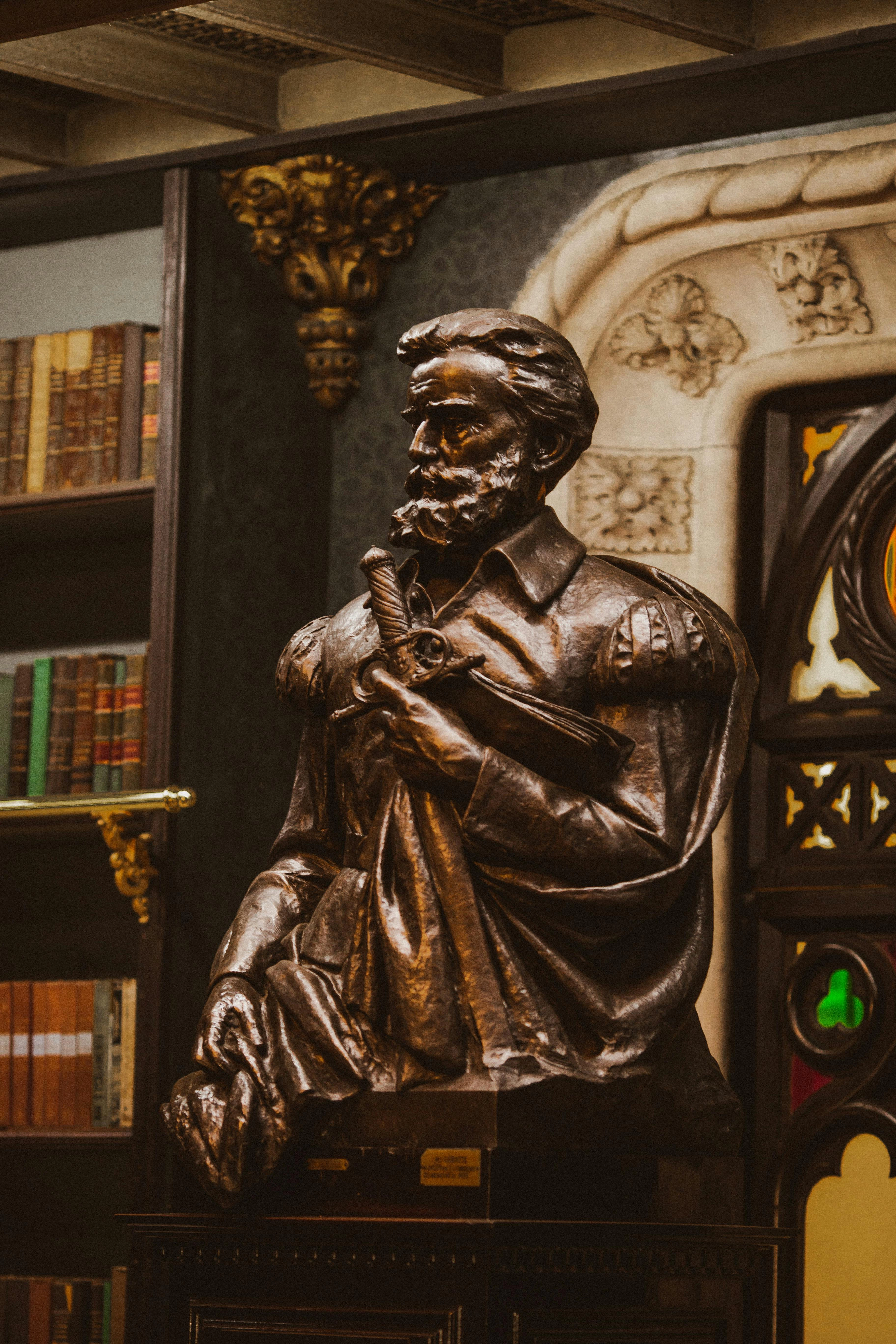 pexels man in black robe statue