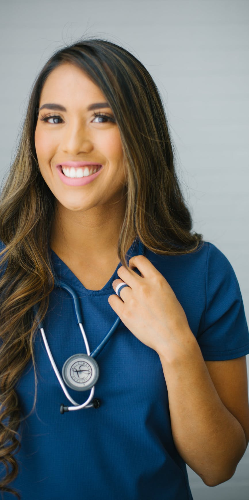 Nurse wearing enso rings and smiling