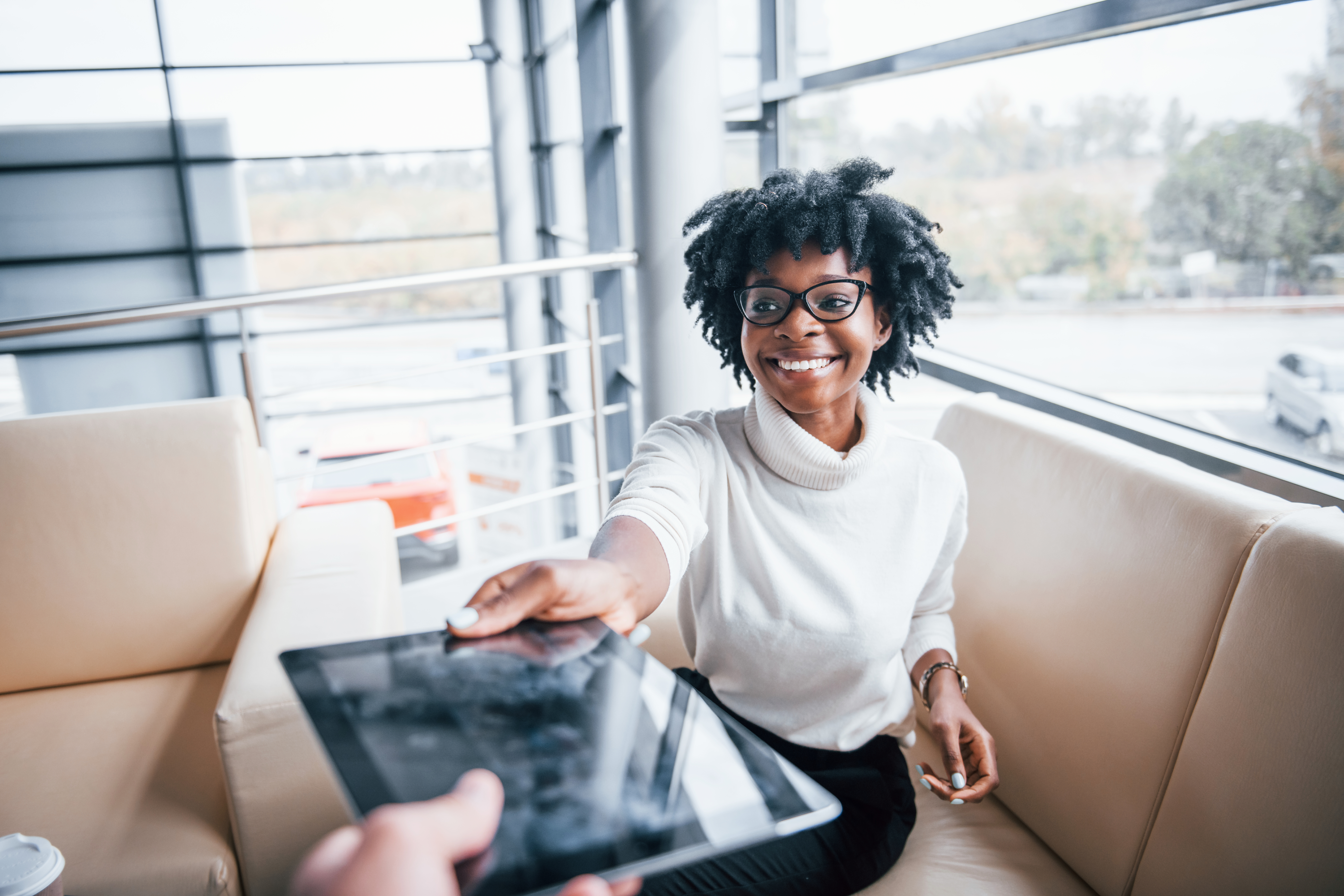 Lady signing her car finance deal