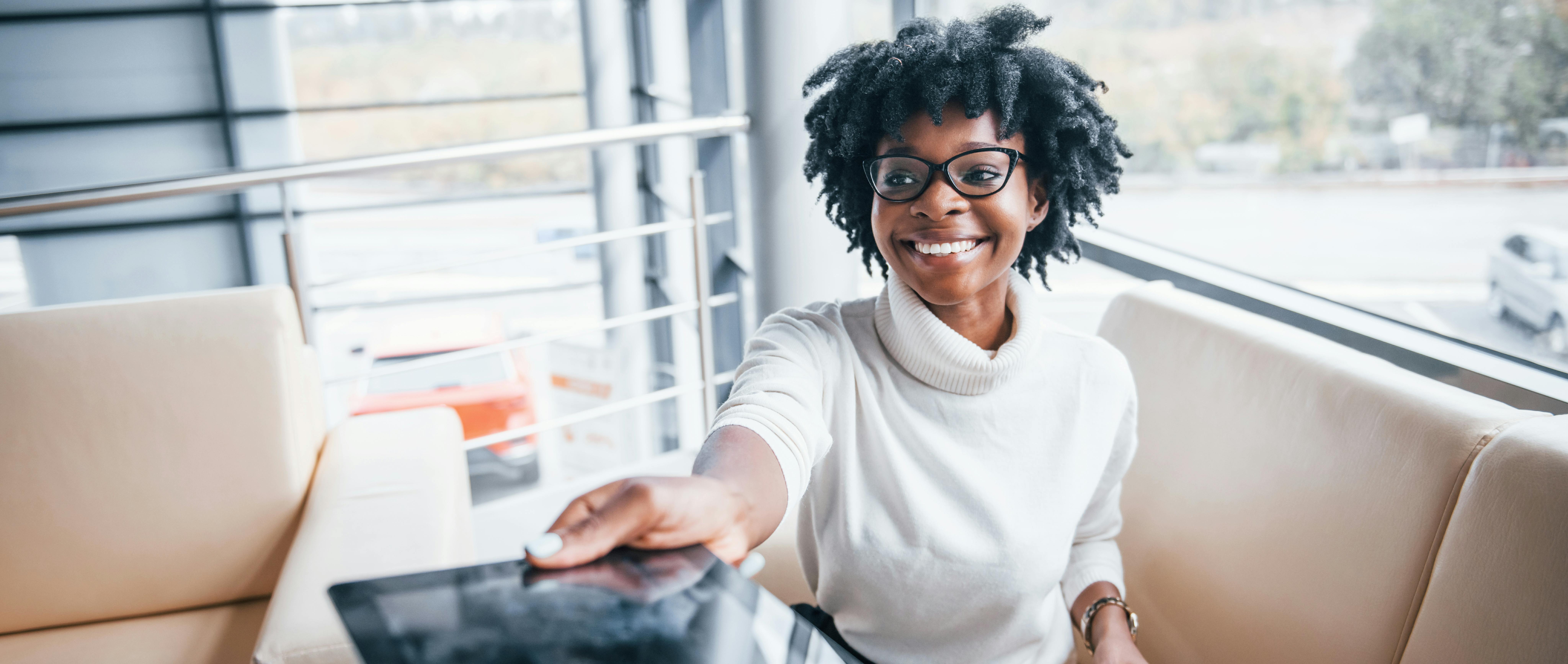 Lady signing her car finance deal