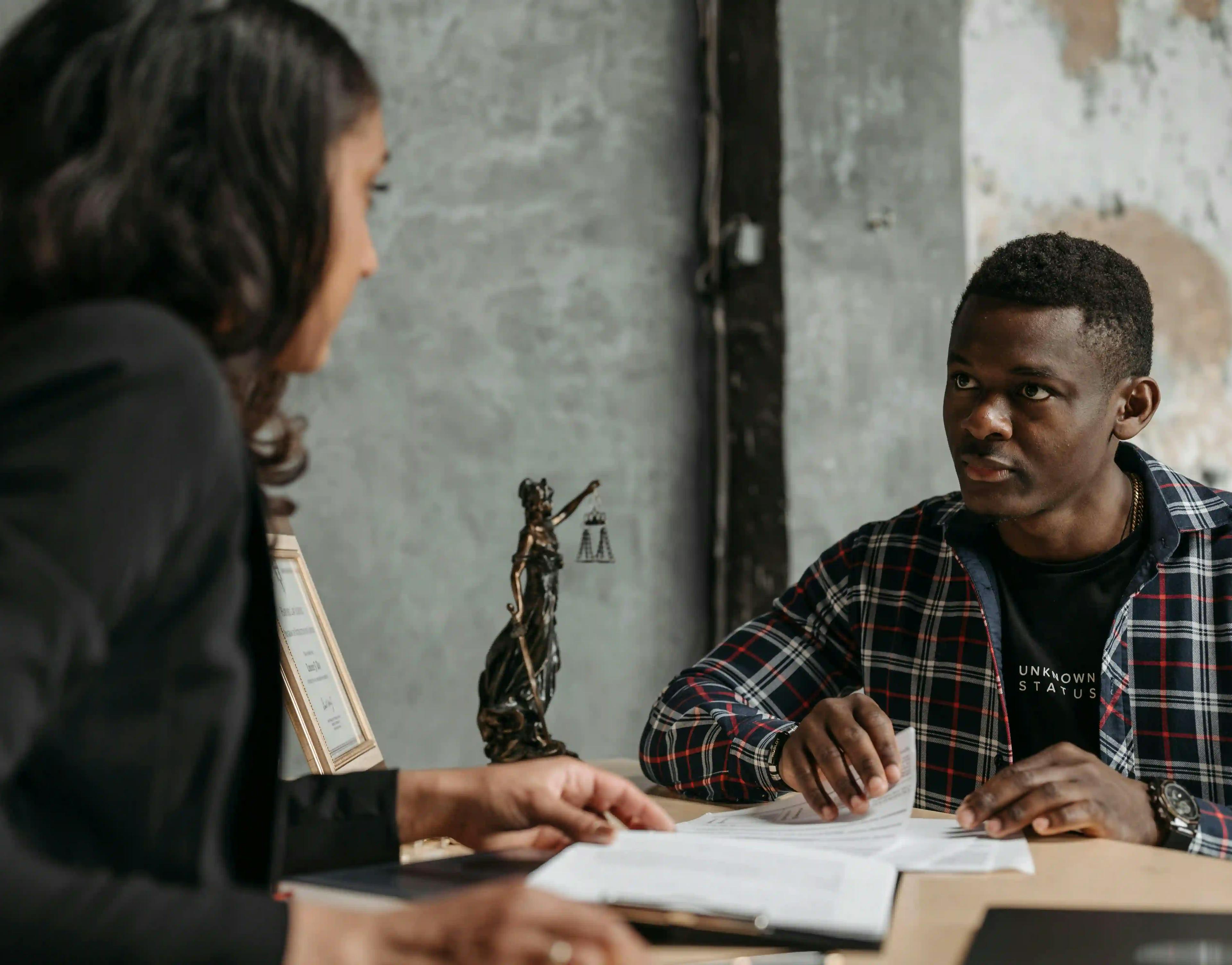 lawyer speaking with client