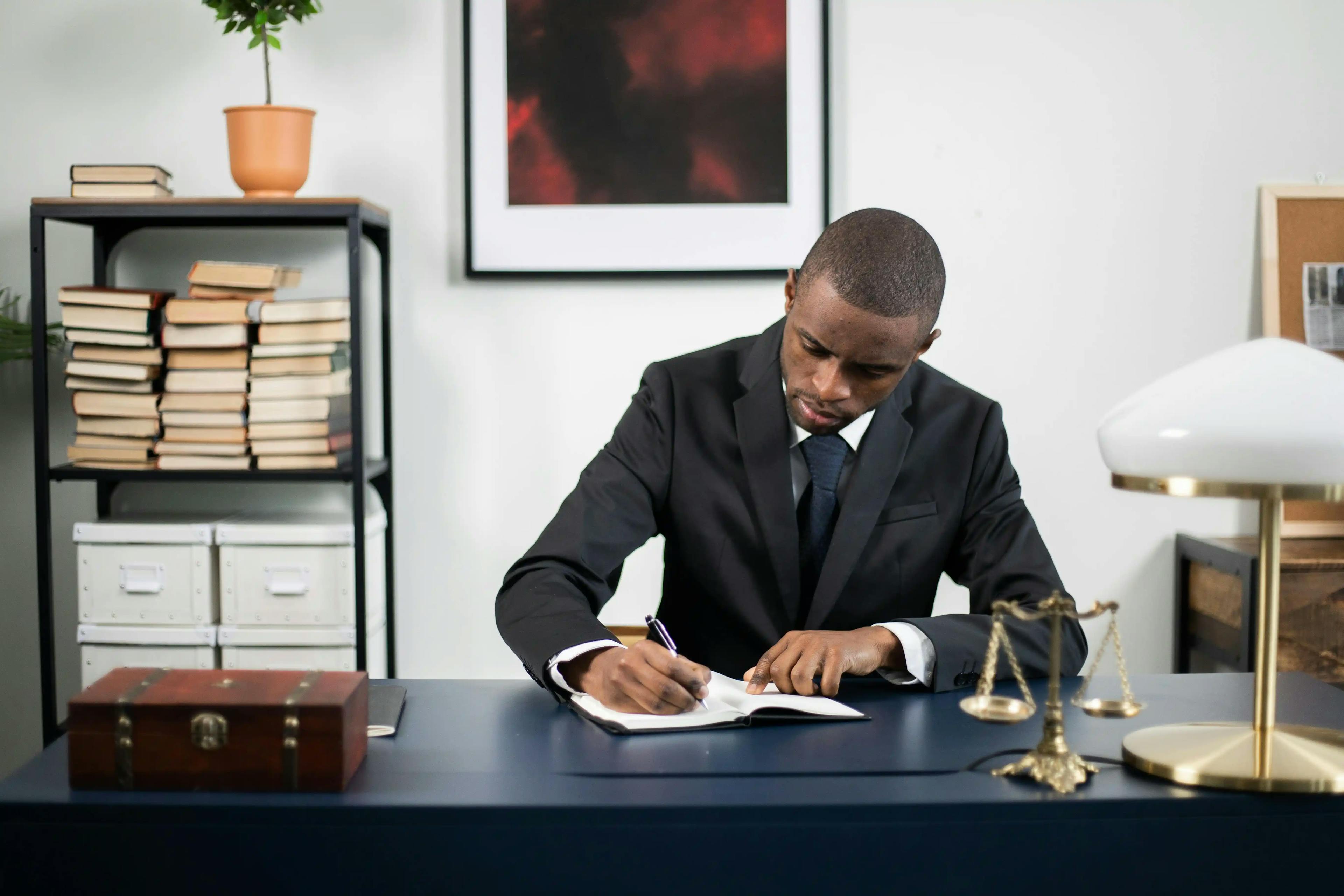 man sitting behind desk