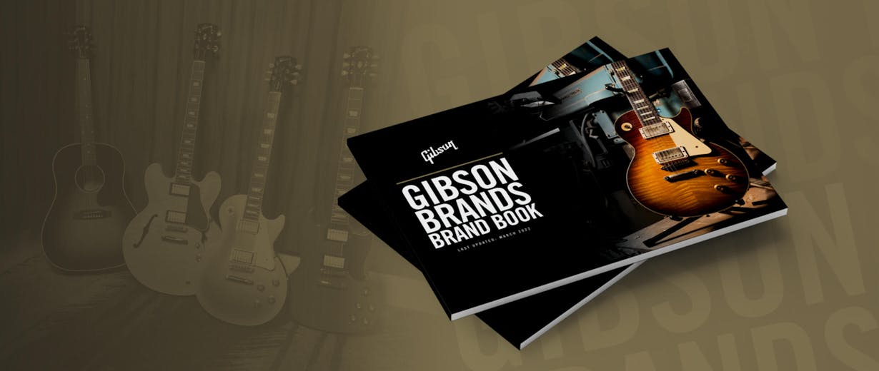 Gibson brand books with Gibson guitars in the background