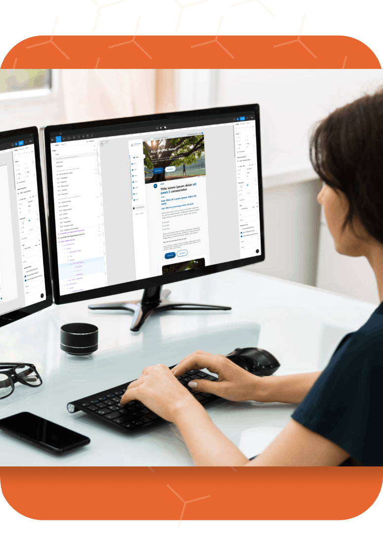 Woman working on multiple screens looking at Novartis design system