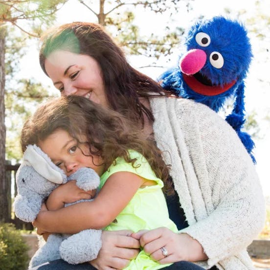 A woman huging her daughter