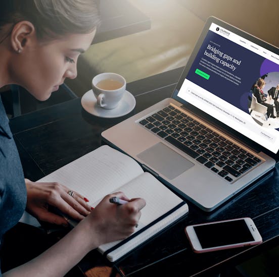 Woman working with a notebook and laptop