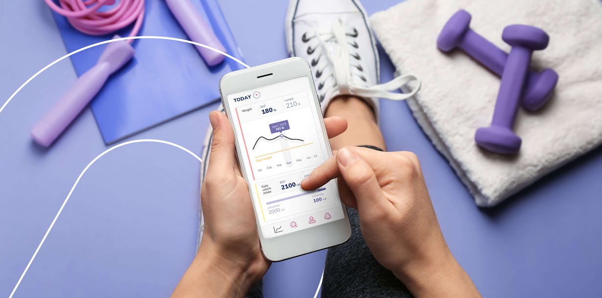 Individual interacting with cellphone reading charts