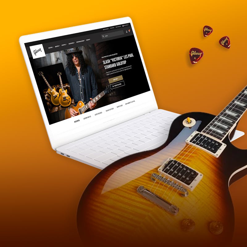 retail experience at Gibson.com on a laptop with a guitar