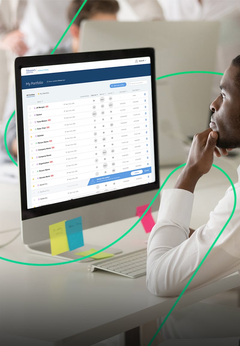 Man looking at aComputer with the Moody's site