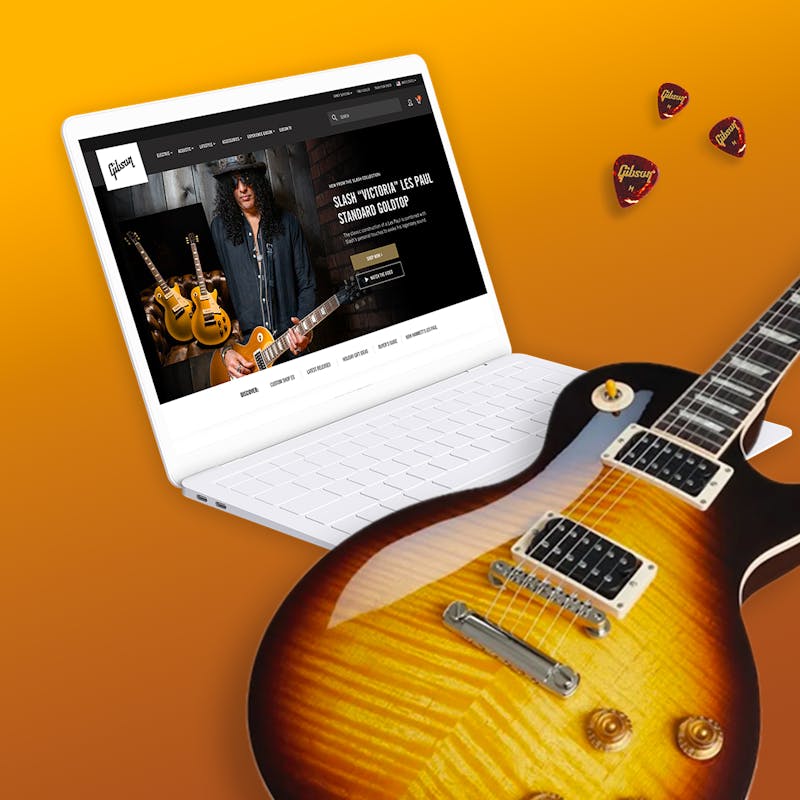 retail experience at Gibson.com on a laptop with a guitar