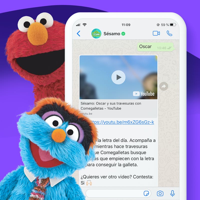 elmo and another Sesame Street character next to a phone with the Whatsapp experience
