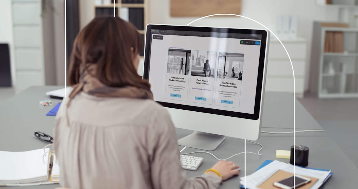 Woman working on a large monitor