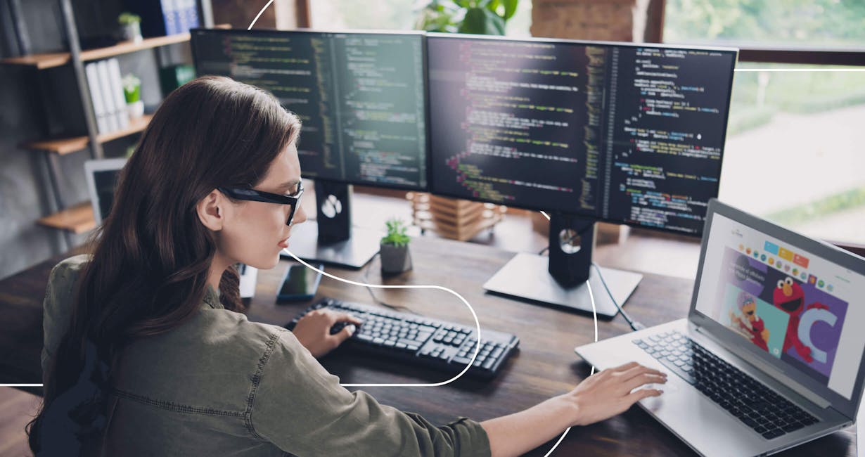 woman working on multiple screens