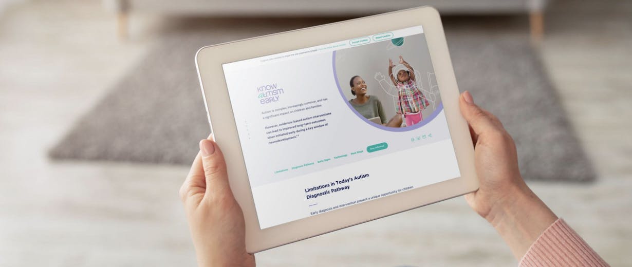 Hands holding a tablet