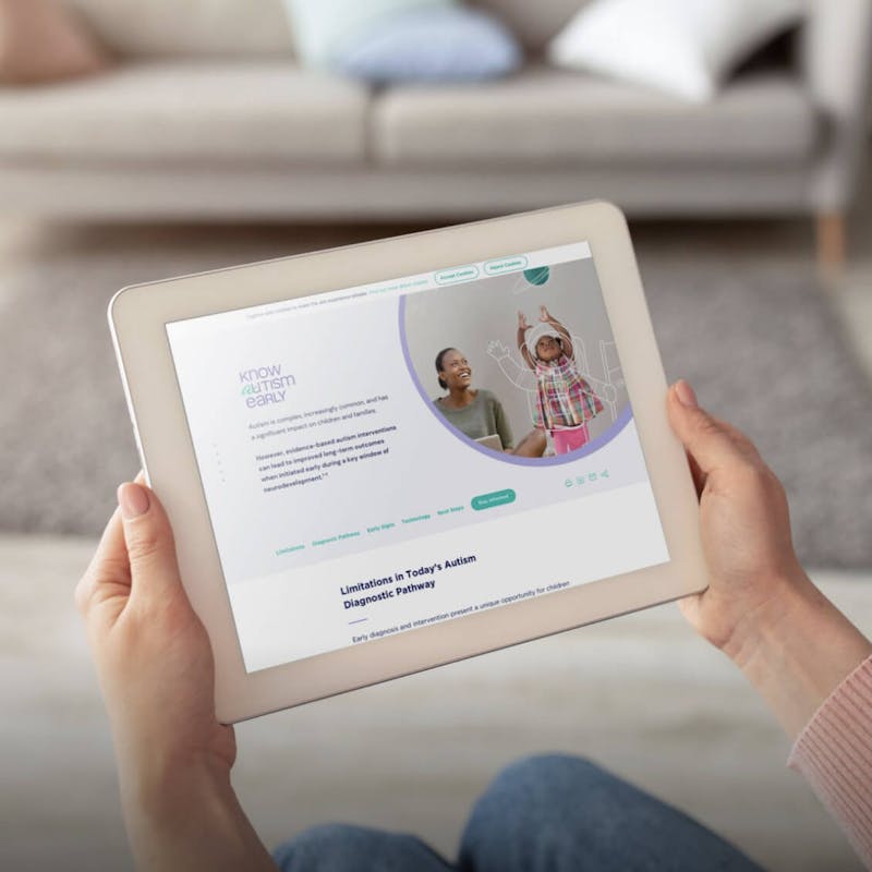 Hands holding a tablet