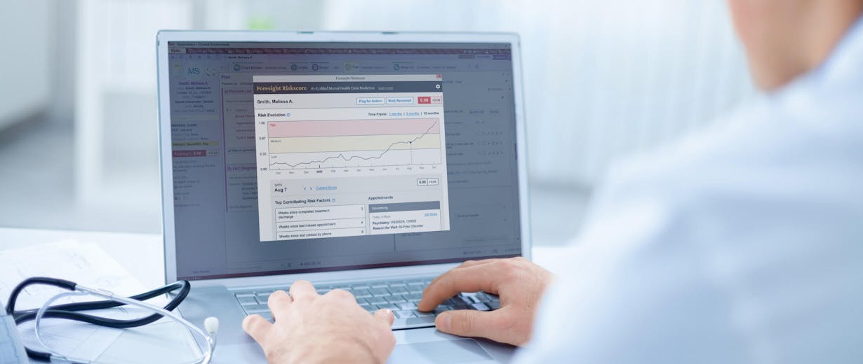 Doctor typing on a laptop