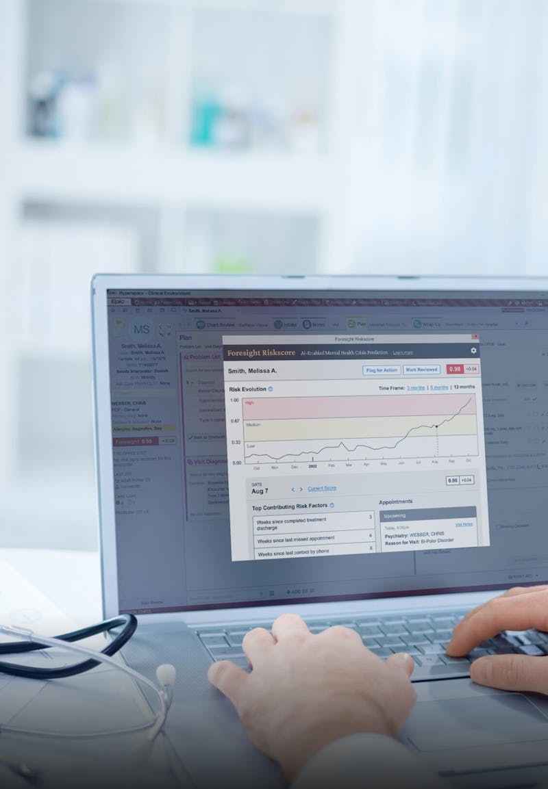 Doctor typing on a laptop