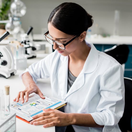 a doctor looking at NODE site over a tablet