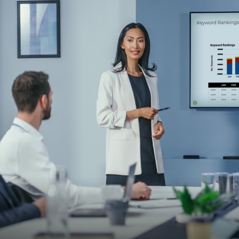 Business woman presenting a chart in a boardroom
