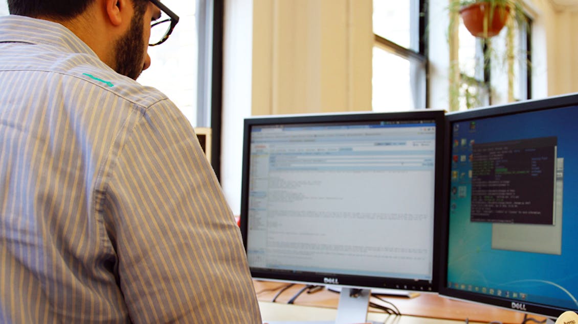 A man looking at his computer