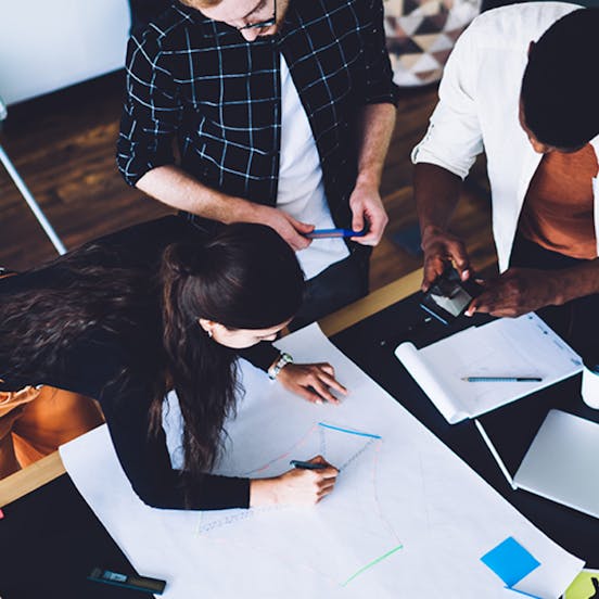 Three people working together