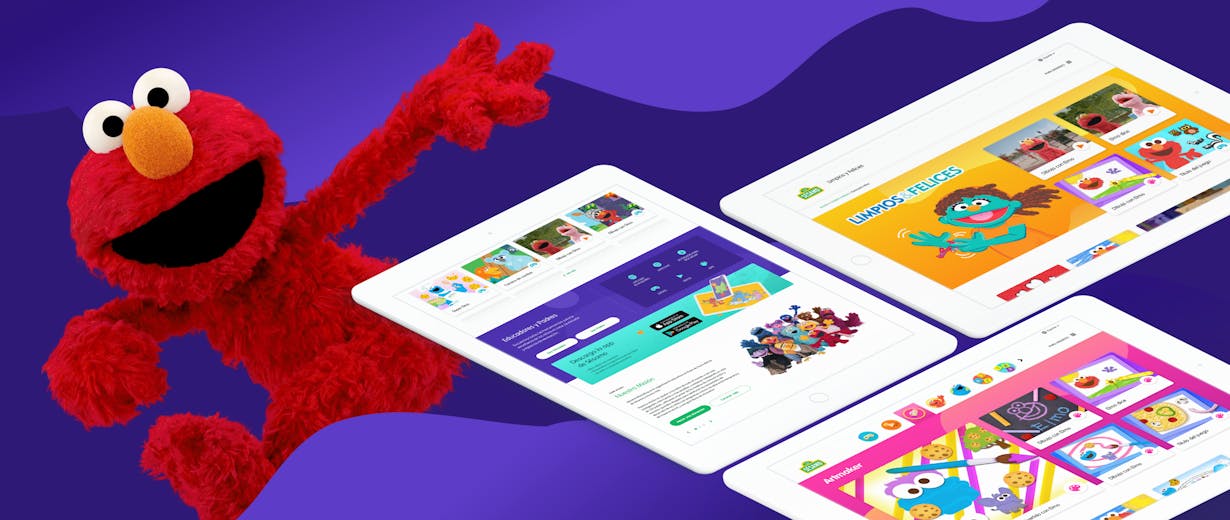 Elmo in a purple background with three tablets showing the Sesame site 