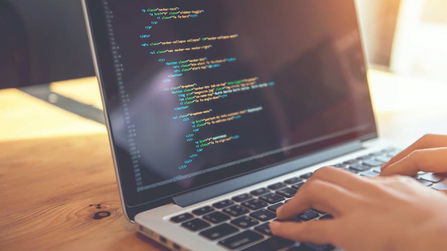 a computer with CSS on the screen