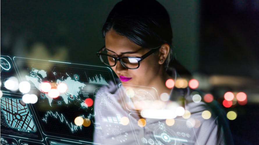 woman looking at futuristic interface screen