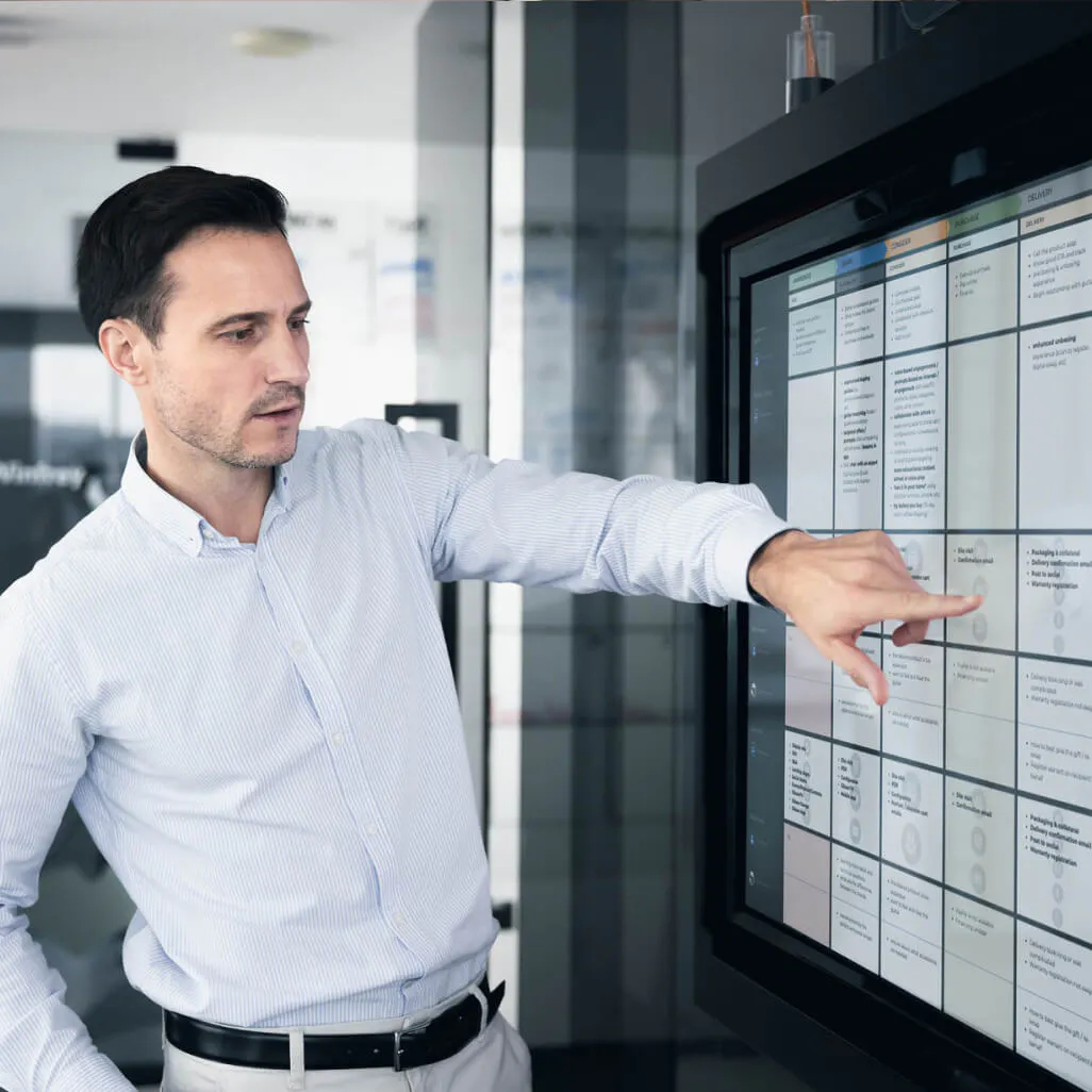 Man pointing at a screen