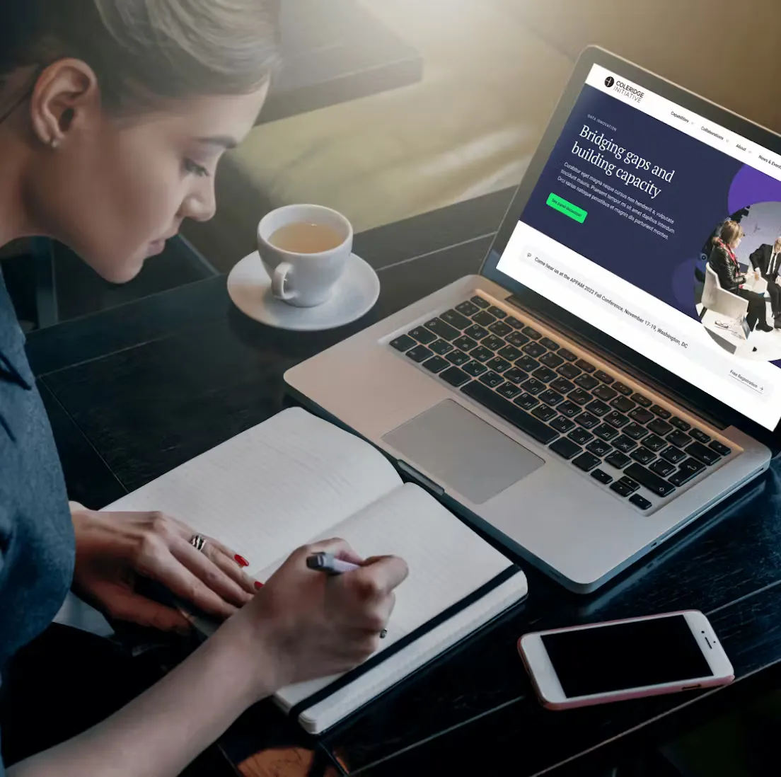 Woman working with a notebook and laptop
