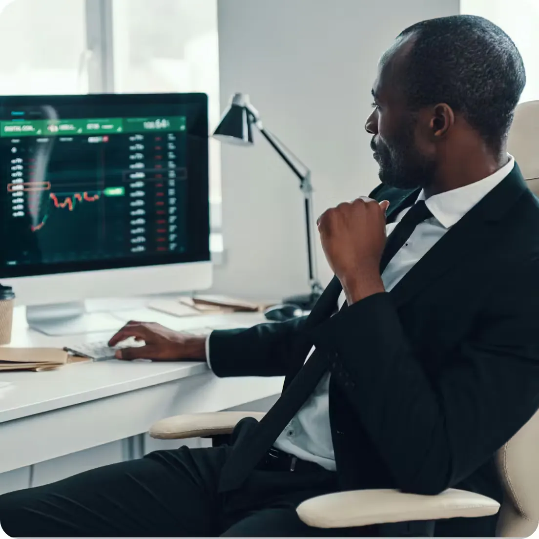 man looking at a graph on a computer