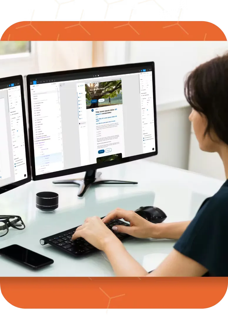 Woman working on multiple screens looking at Novartis design system