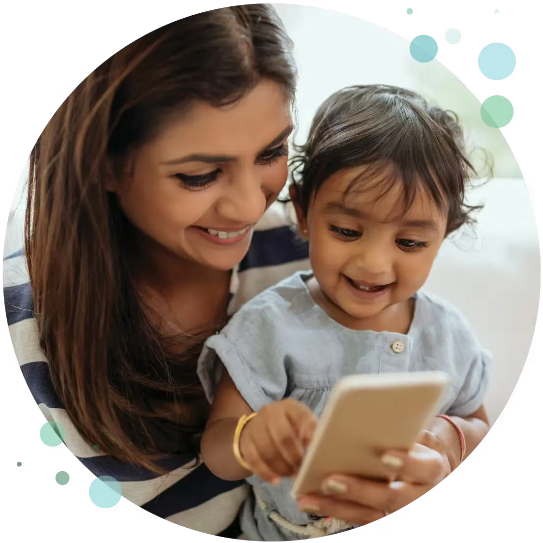 a mother with her son looking at a phone
