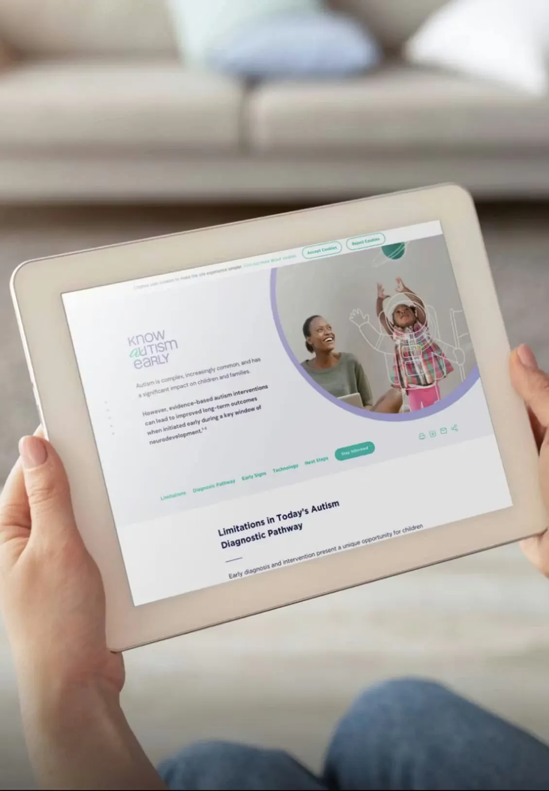 Hands holding a tablet