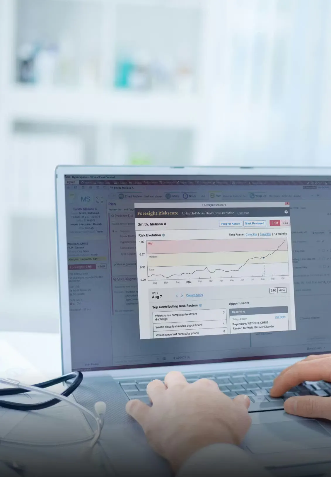 Doctor typing on a laptop