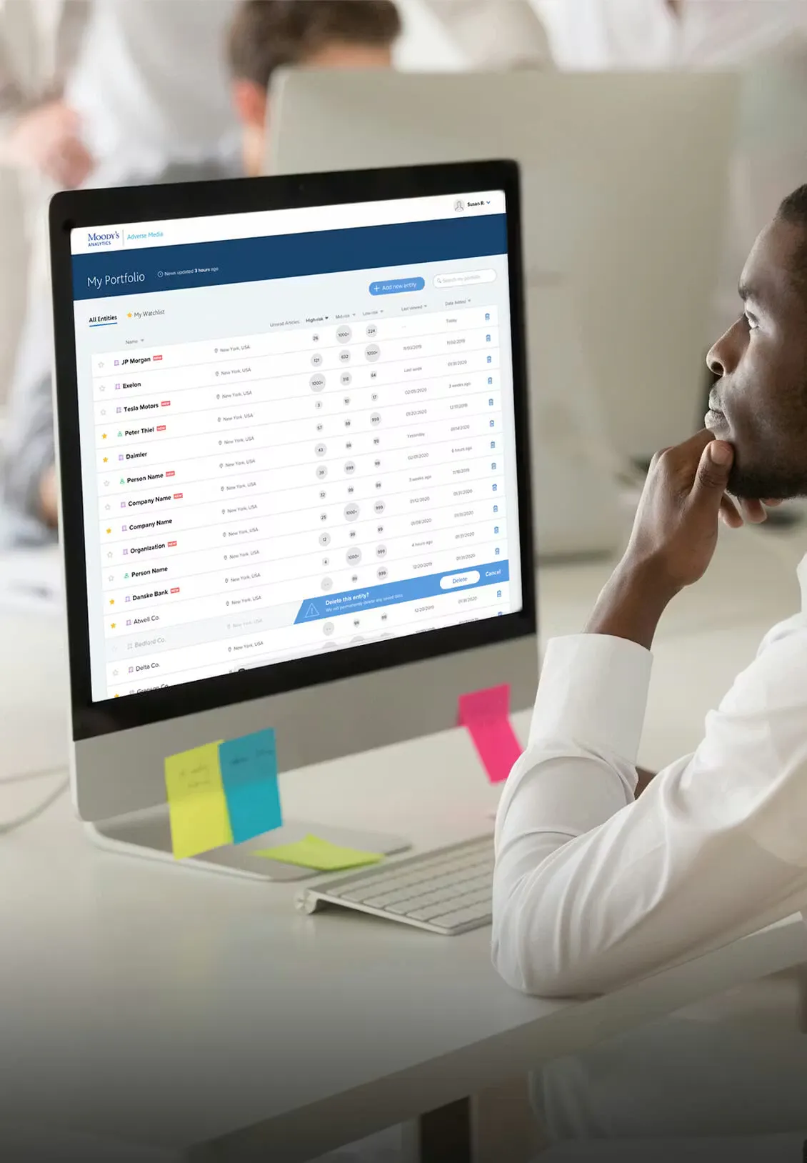 Man looking at a Computer with the Moody's site