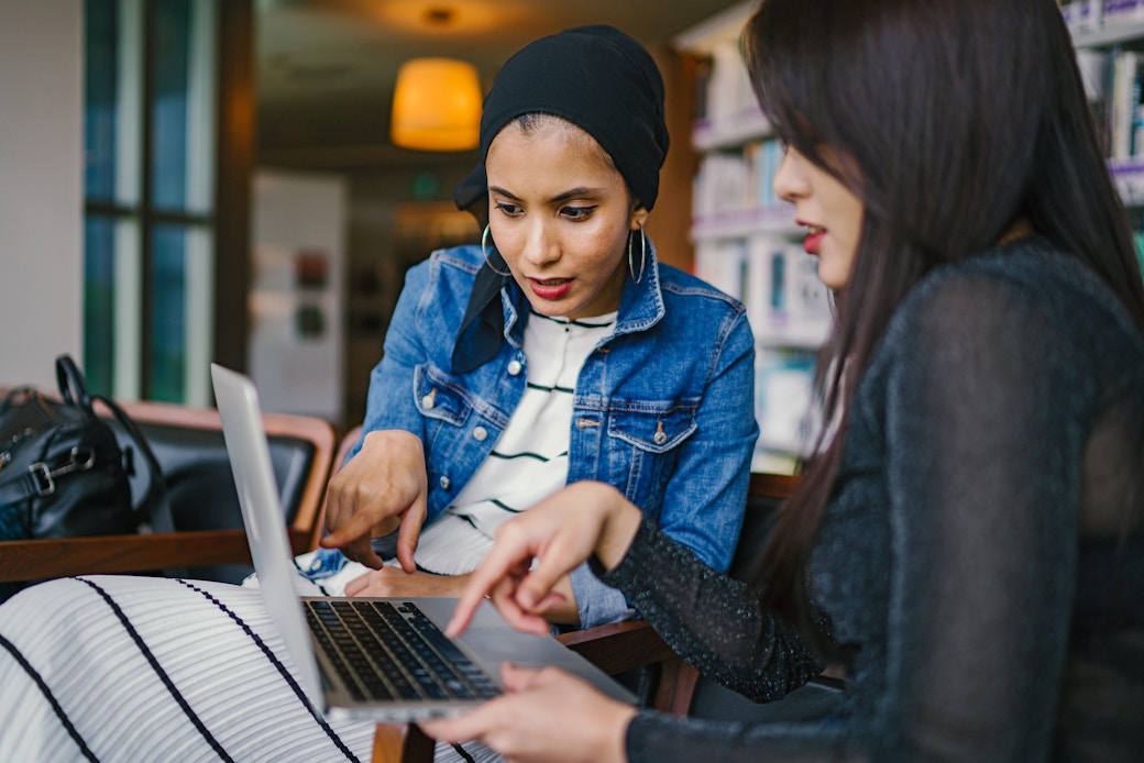 two women working on computer