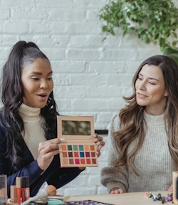 women filming beauty content