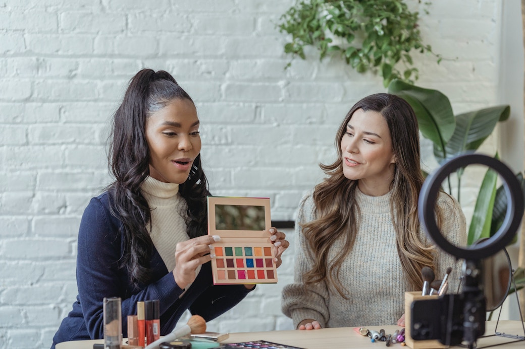 women filming beauty content