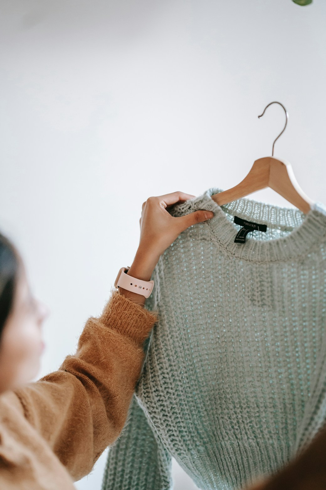 women admiring sweater