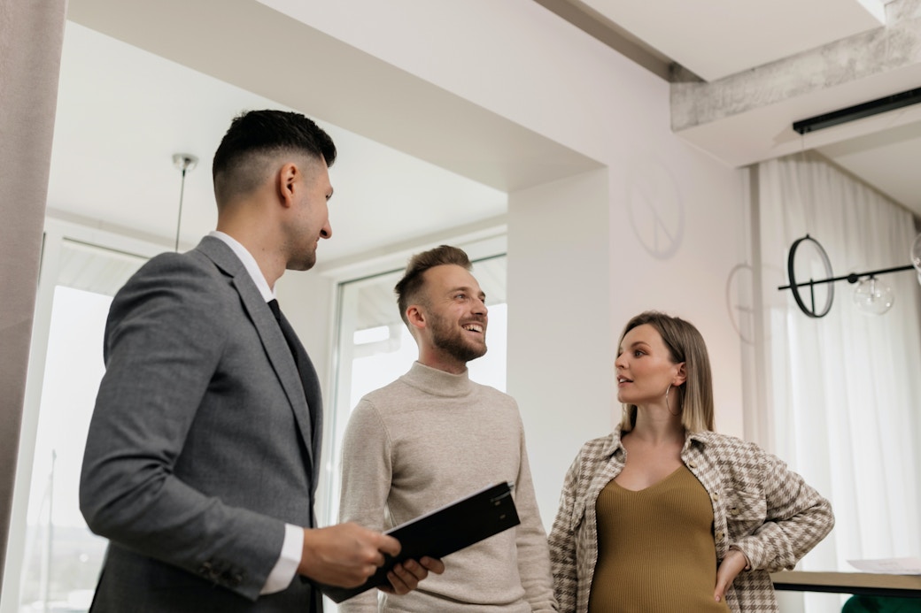 couple with real estate agent