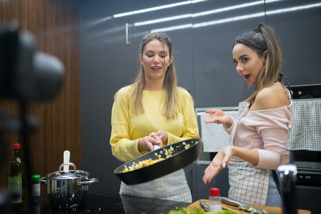 women filming cooking content