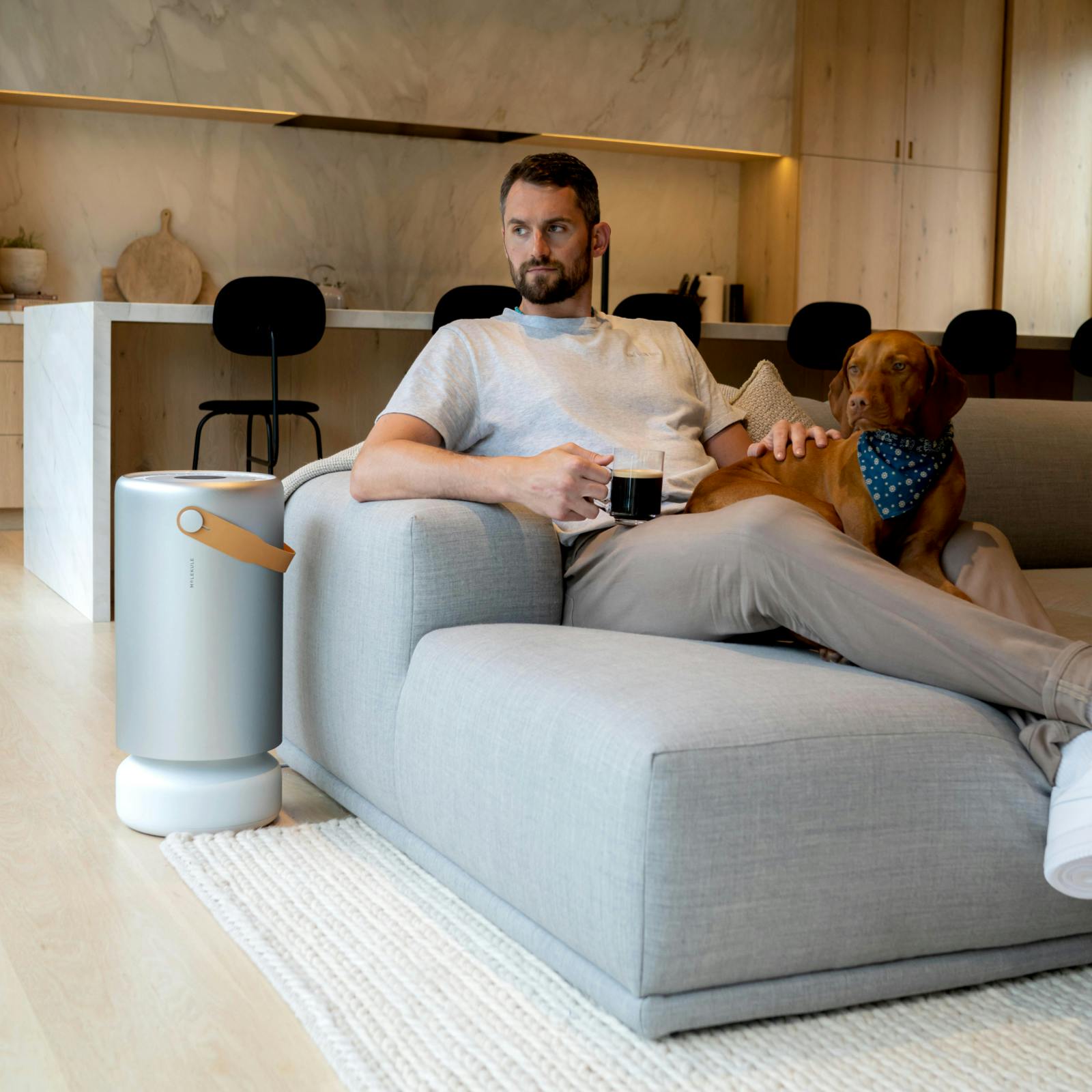 Kevin Love sitting next to a dog | Molekule